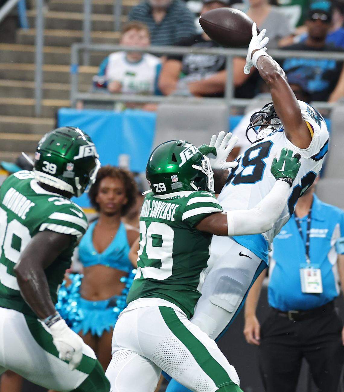 Carolina Panthers wide receiver Terrace Marshall Jr., right, is unable to make a pass reception in the end zone as New York Jets safety Darius Monroe, left and cornerback Jarrick Bernard-Converse, center, apply pressure during first quarter action at Bank of America Stadium in Charlotte, NC on Saturday, August 17, 2024.