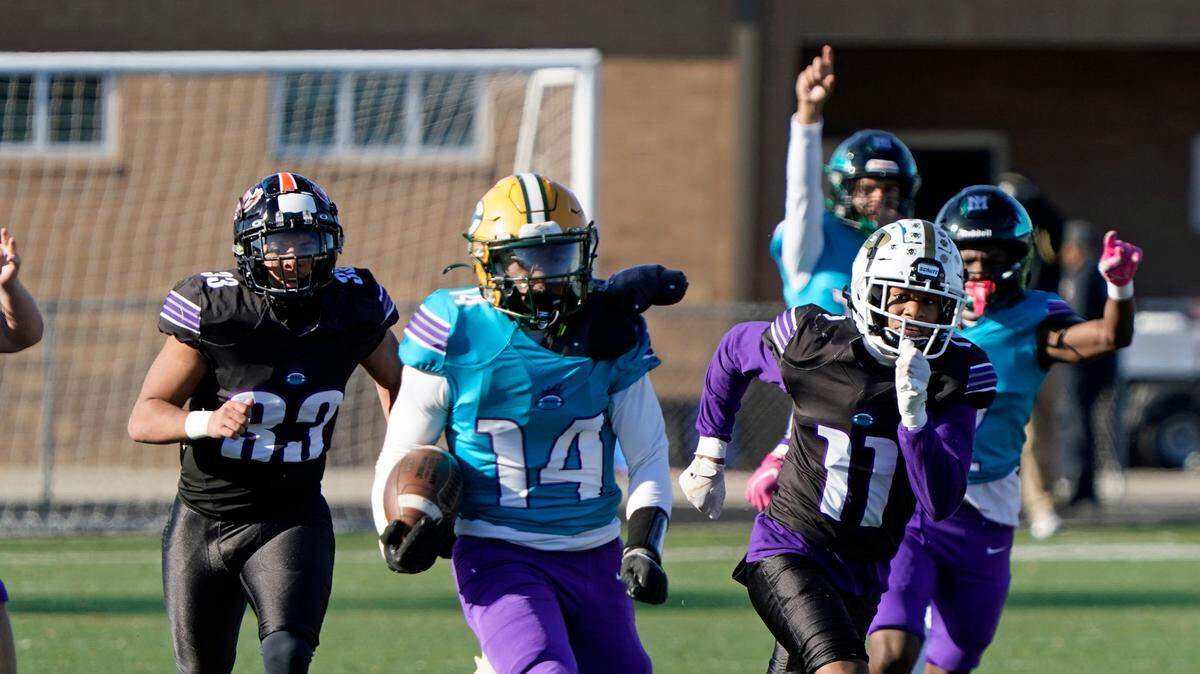 West running back AIden Carson of Crest High School, center, races downfield on a 48-yard touchdown run during the fourth quarter of Saturday’s Queen City Senior Bowl high school football game at Olympic High School in Charlotte, N.C.