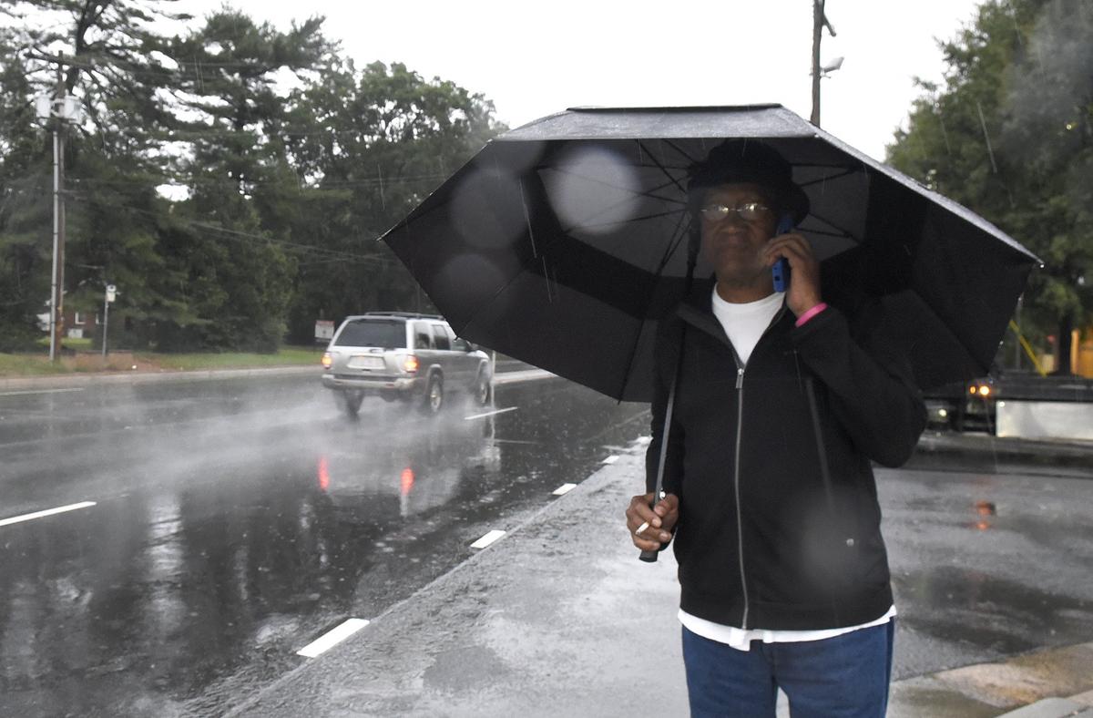A pedestrian braved the rain Thursday morning along W. Sugar Creek Road.  Hurricane Michael, which blasted the Florida panhandle as a strong category 4and drove through Georgia overnight bringing wind and rain to the Carolinas on Thursday, Oct. 11, 2018.