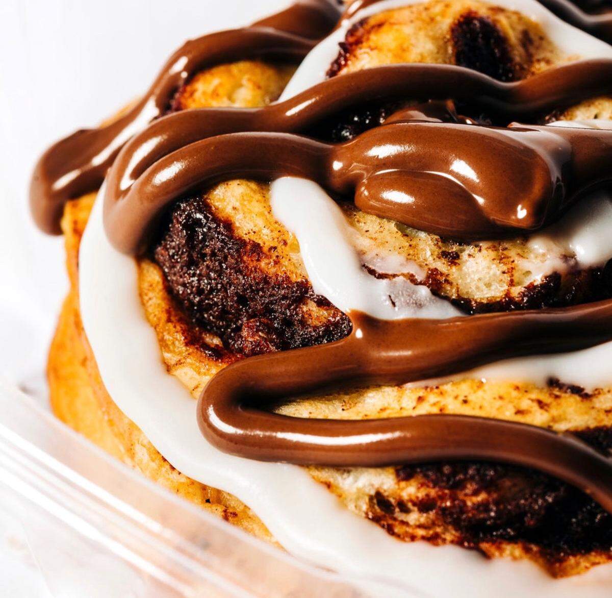 The Peach Cobbler Factory, based in Nashville, which serves 12 flavors of cobbler plus banana pudding and cinnamon rolls, shown, will open a ghost kitchen March 30 in Charlotte’s South End.