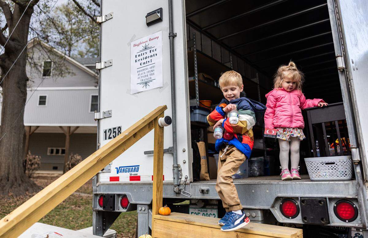 Declan Fennel, 5, and his younger sister, Jojo, photographed last November while paying a visit with their dad to a pop-up goodwill trailer near the Fennels’ home on Riverside Drive in Charlotte.