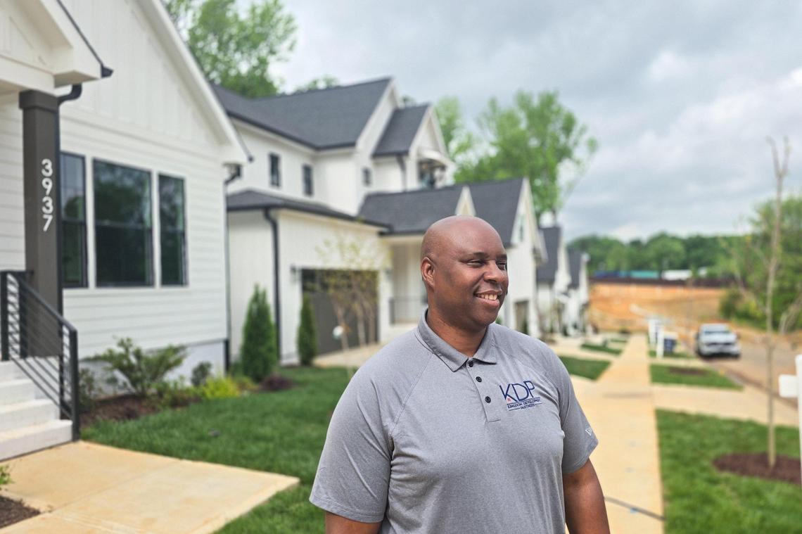 Developer James Scruggs is seen outside of The Enclave at Enderly Park, a 15-home subdivision where prices begin at $950,000.