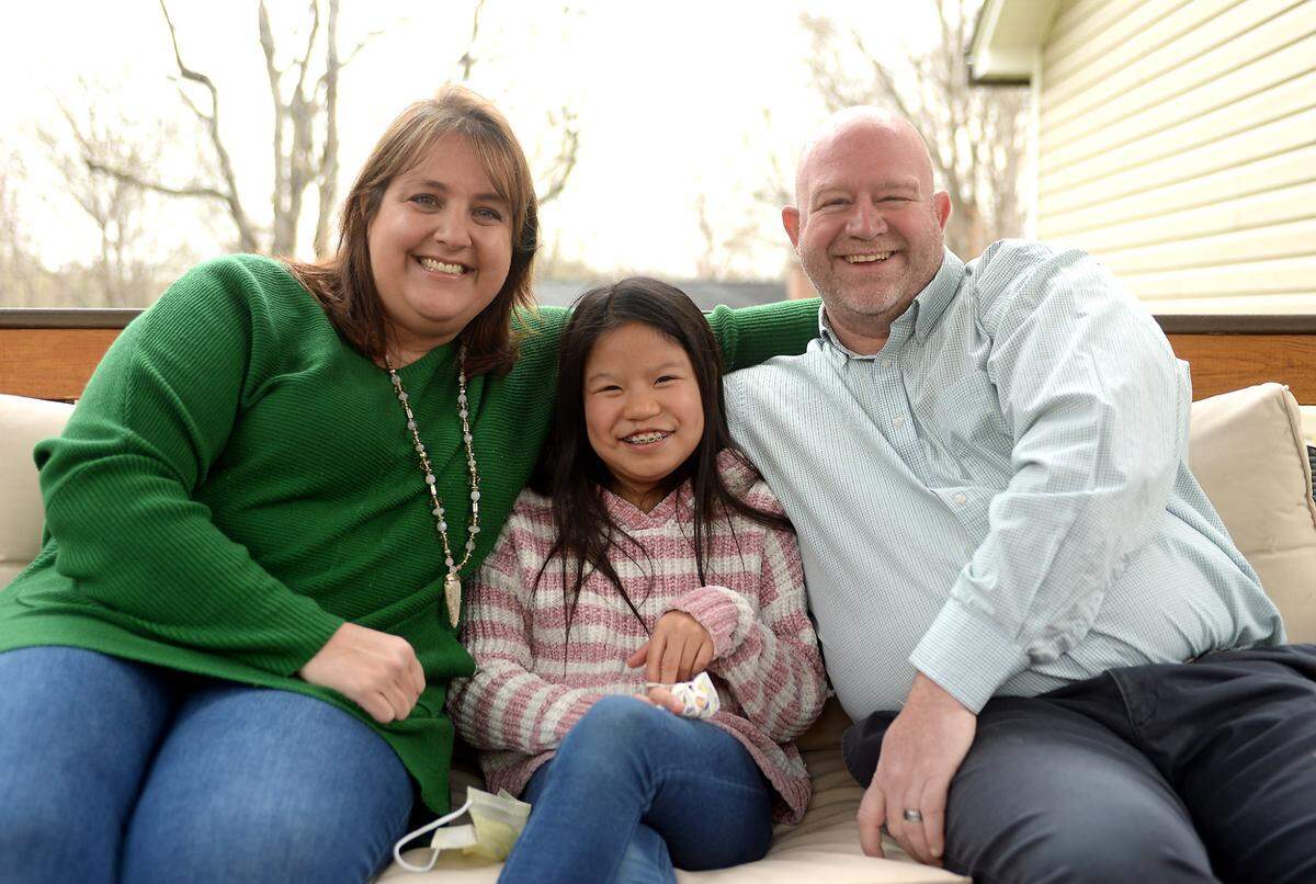 Says Angie Guy, photographed with her daughter Sarah and her husband Jerry: “I just felt like God had the whole thing orchestrated. She absolutely was the child that was meant for us.”