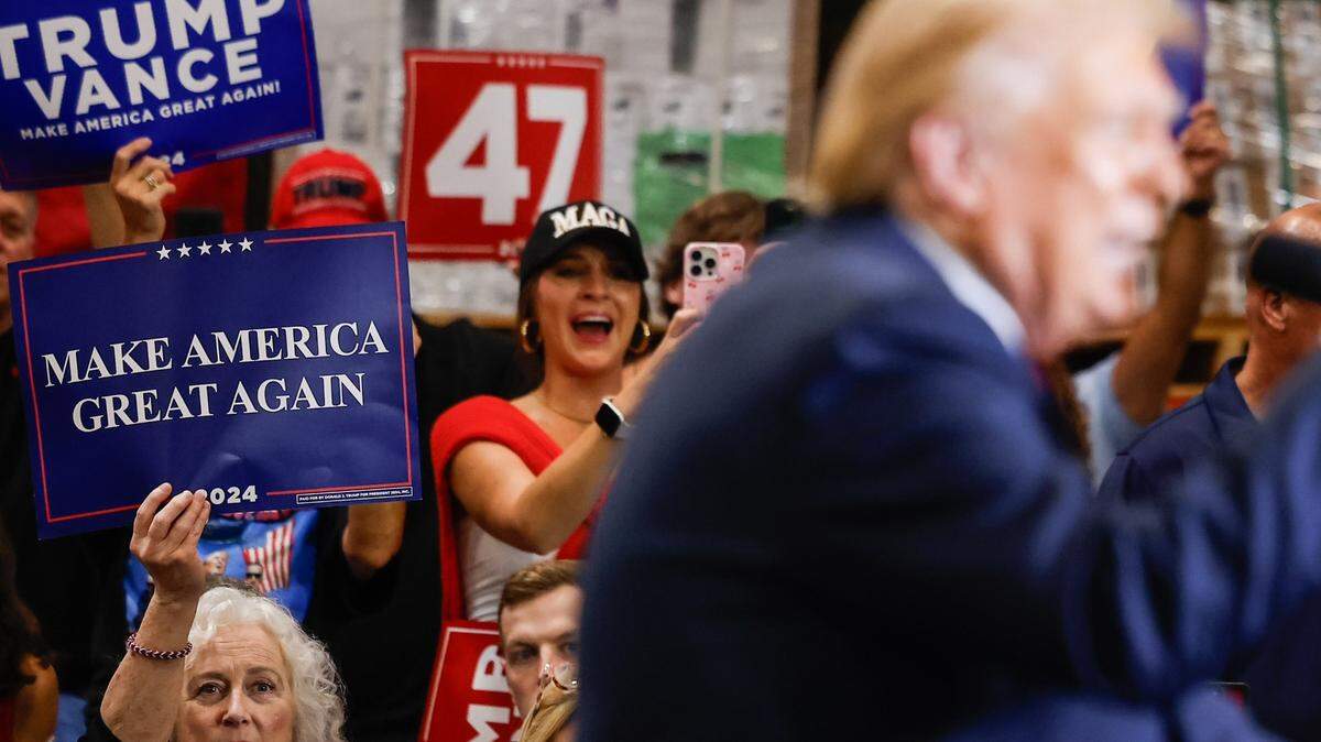 Supporters cheer for Former President Donald Trump as he delivers remarks at a campaign rally inside the Mosack Group manufacturing warehouse in Mint Hill, NC on Wednesday, September 25, 2024. 