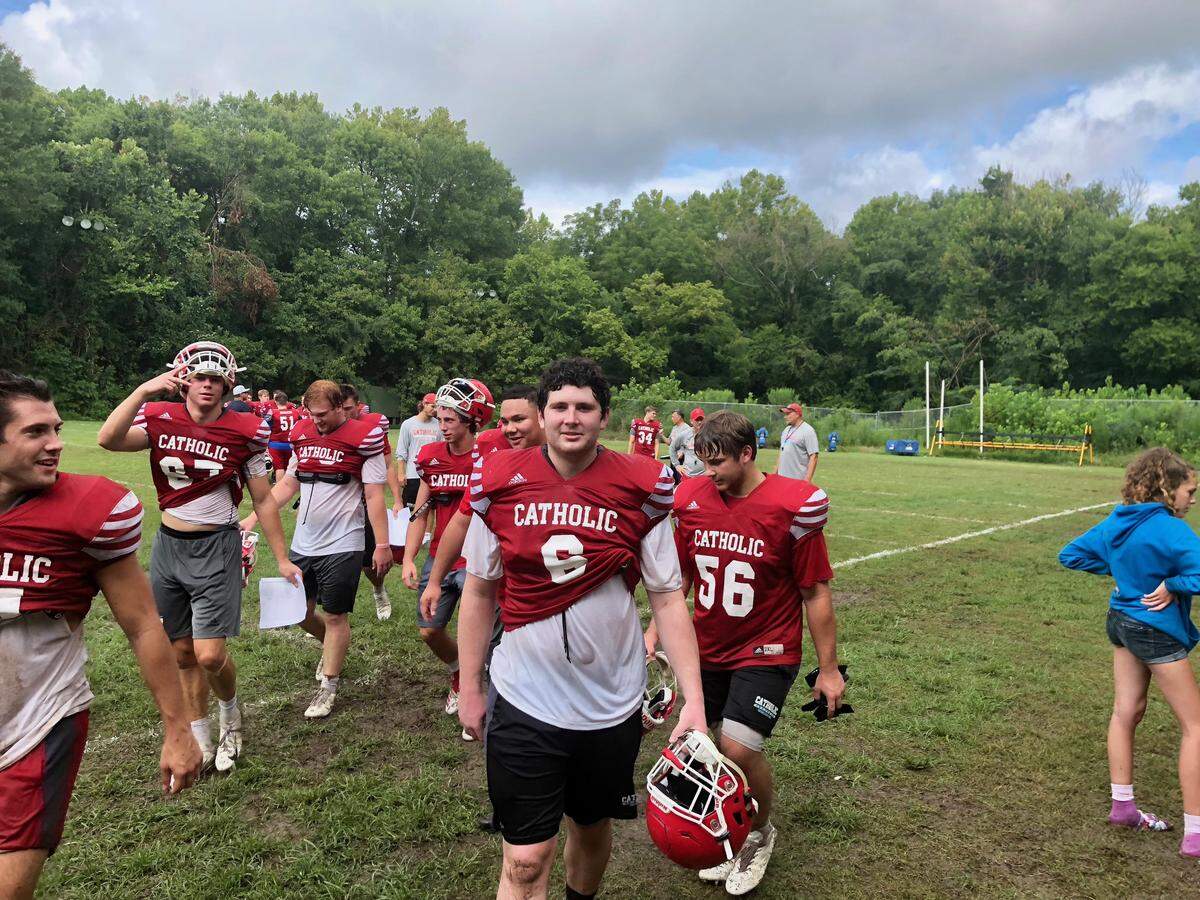 Charlotte Catholic and defensive lineman Kevin Coss (center) return most of the starters from its 2018 state champion in a bid to repeat