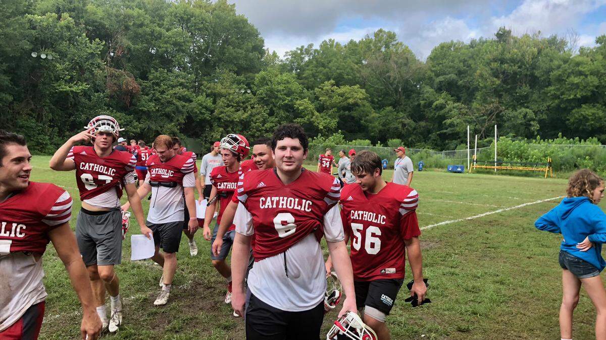 Charlotte Catholic and defensive lineman Kevin Coss (center) return most of the starters from its 2018 state champion in a bid to repeat
