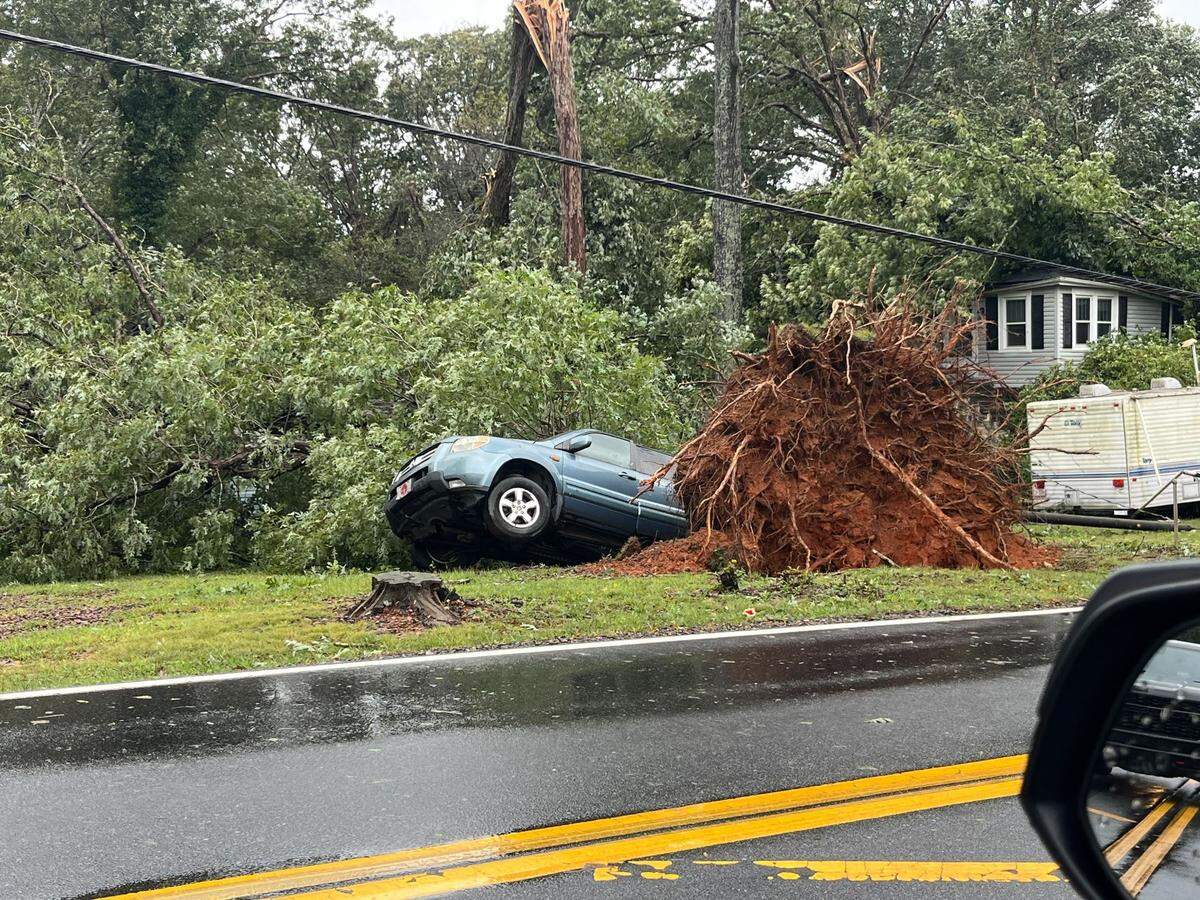 A vehicle was crushed by a falling tree in the Asheville and Arden area of western North Carolina as Helene struck on Friday.
