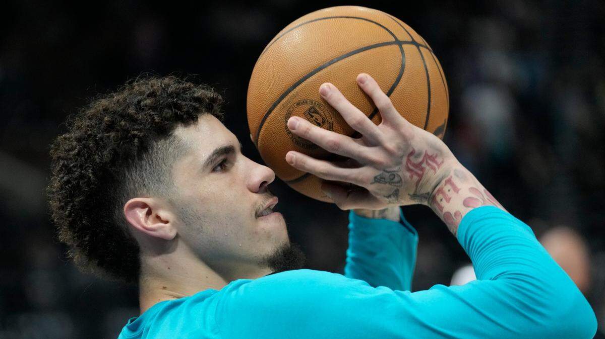 Charlotte Hornets guard LaMelo Ball warms up before the start of an NBA basketball game against the Utah Jazz Monday, Jan. 23, 2023, in Salt Lake City. (AP Photo/Rick Bowmer)