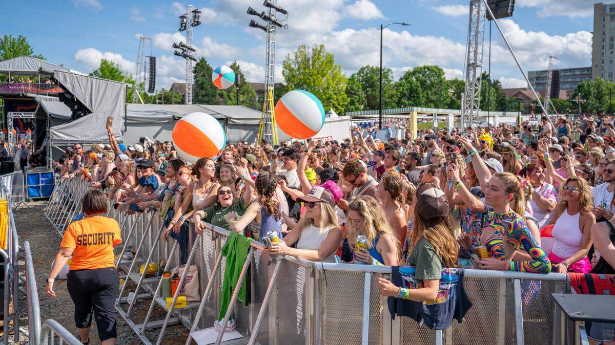 Fans at Lovin’ Life Music Fest bounce around beach balls between sets.