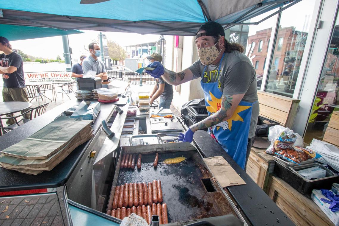 Vic “The Chili Man” Werany works his hot dog cart in front of 7th Street Public Market last year. Werany had already sold The Chili Man cart, but he came out to sling hot dogs one last day as his retirement party.