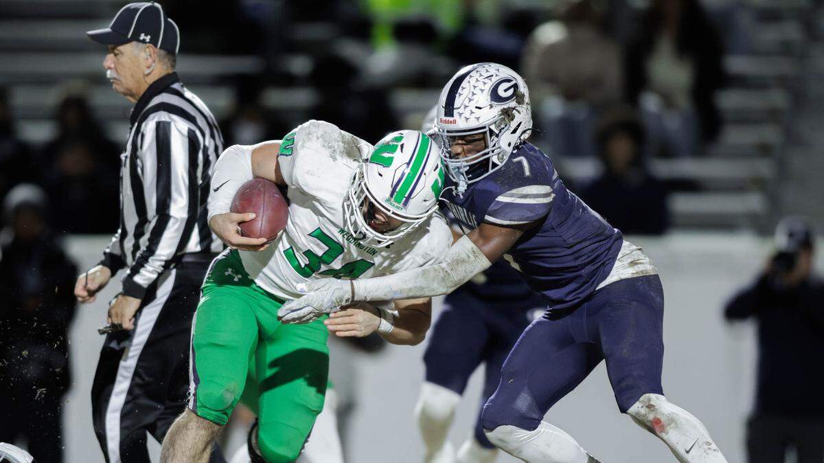 Grimsley’s Ryan Debow (7) gets the tackle for a loss during first half action. Weddington would play Grimsley in the NCHSAA 4A state semifinals Friday December 13, 2024.