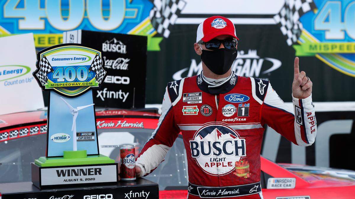 Kevin Harvick celebrates after winning a NASCAR Cup Series auto race at Michigan International Speedway in Brooklyn, Mich., Sunday, Aug. 9, 2020. (AP Photo/Paul Sancya)