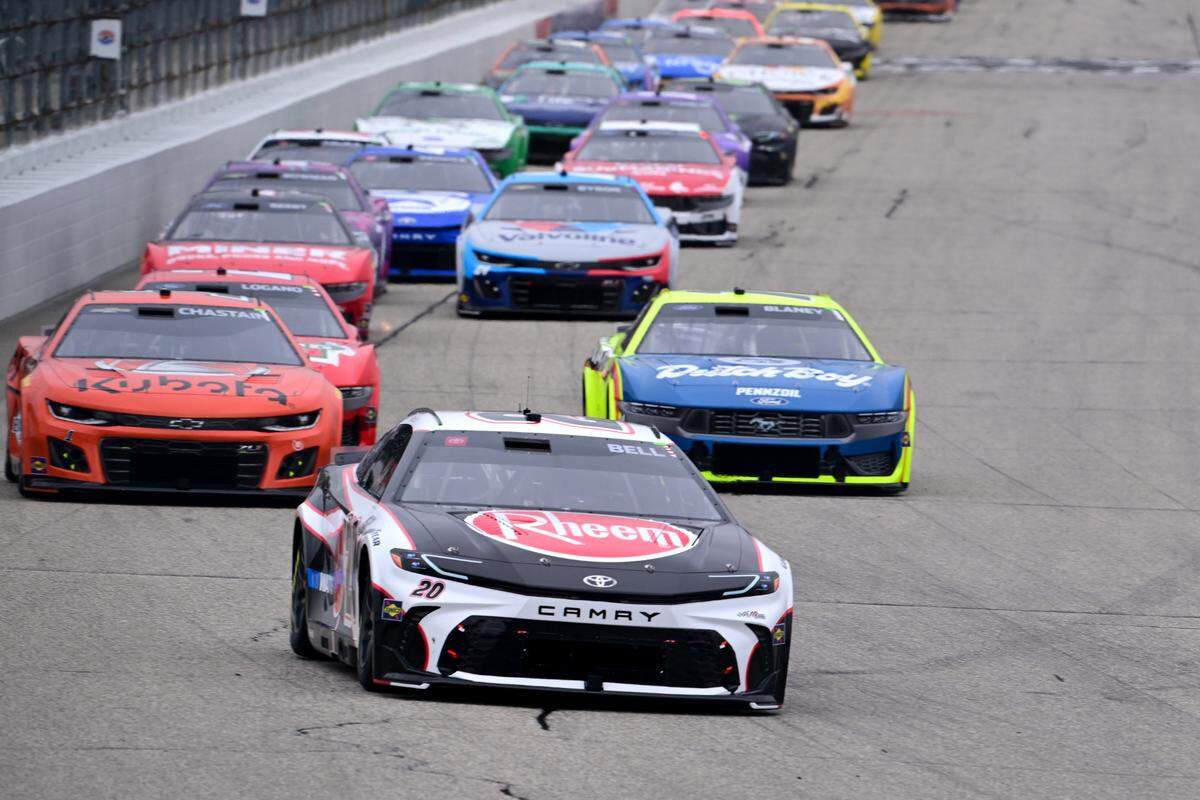 Jun 23, 2024; Loudon, New Hampshire, USA; NASCAR Cup Series driver Christopher Bell (20) leads a pack of cars during the USA Today 301 at New Hampshire Motor Speedway.