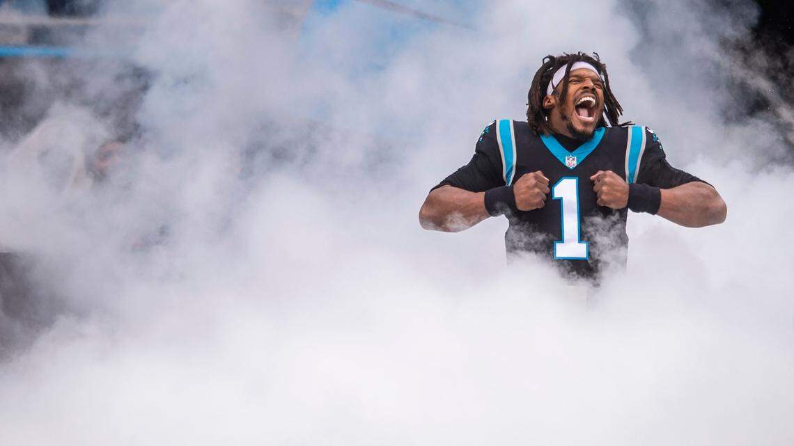 Panthers quarterback Cam Newton does his signature Superman pose during introductions before the game against the Washington Football Team at Bank of America Stadium on Sunday, November 21, 2021 in Charlotte, NC.