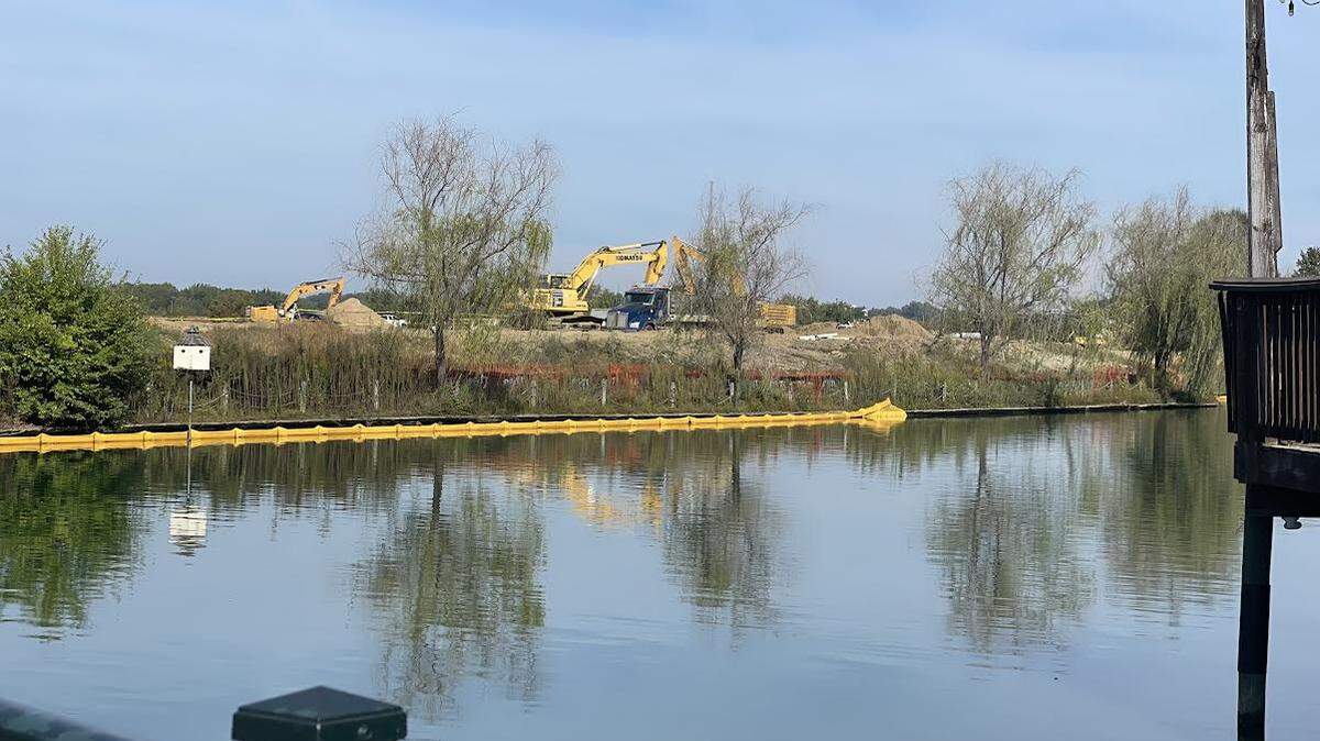 Construction is beginning along a lake in University City where developers are planning to build apartments and office as well as improving the surrounding park.