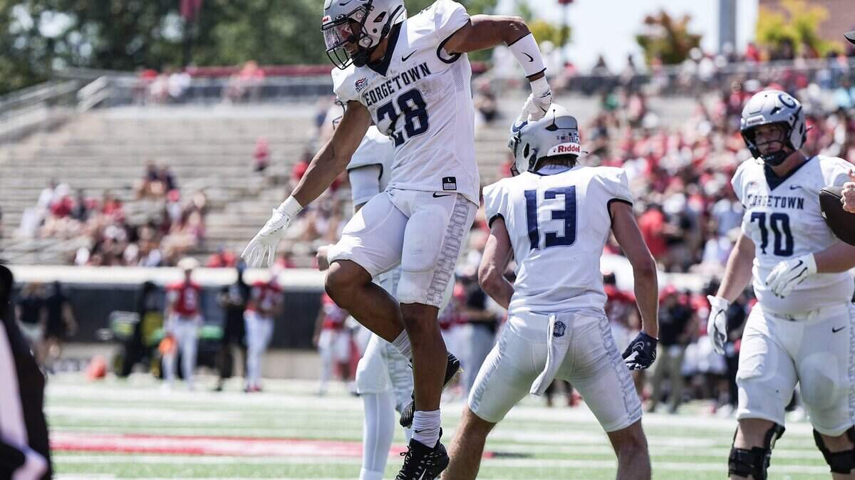 Georgetown running back Savion Hart (28) celebrates scoring a touchdown during the first half of a NCAA FCS football game against Davidson, Saturday, Aug. 30, 2025, in Davidson, N.C.