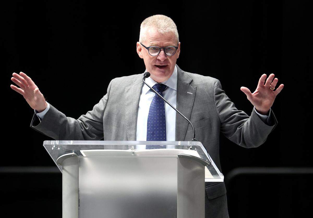Former NASCAR driver Jeff Burton speaks during a memorial service Friday morning at Bojangles Coliseum in Charlotte. The ceremony was held to honor the lives lost in the Dec. 18, 2025 plane crash in Statesville that included former NASCAR driver Greg Biffle. 