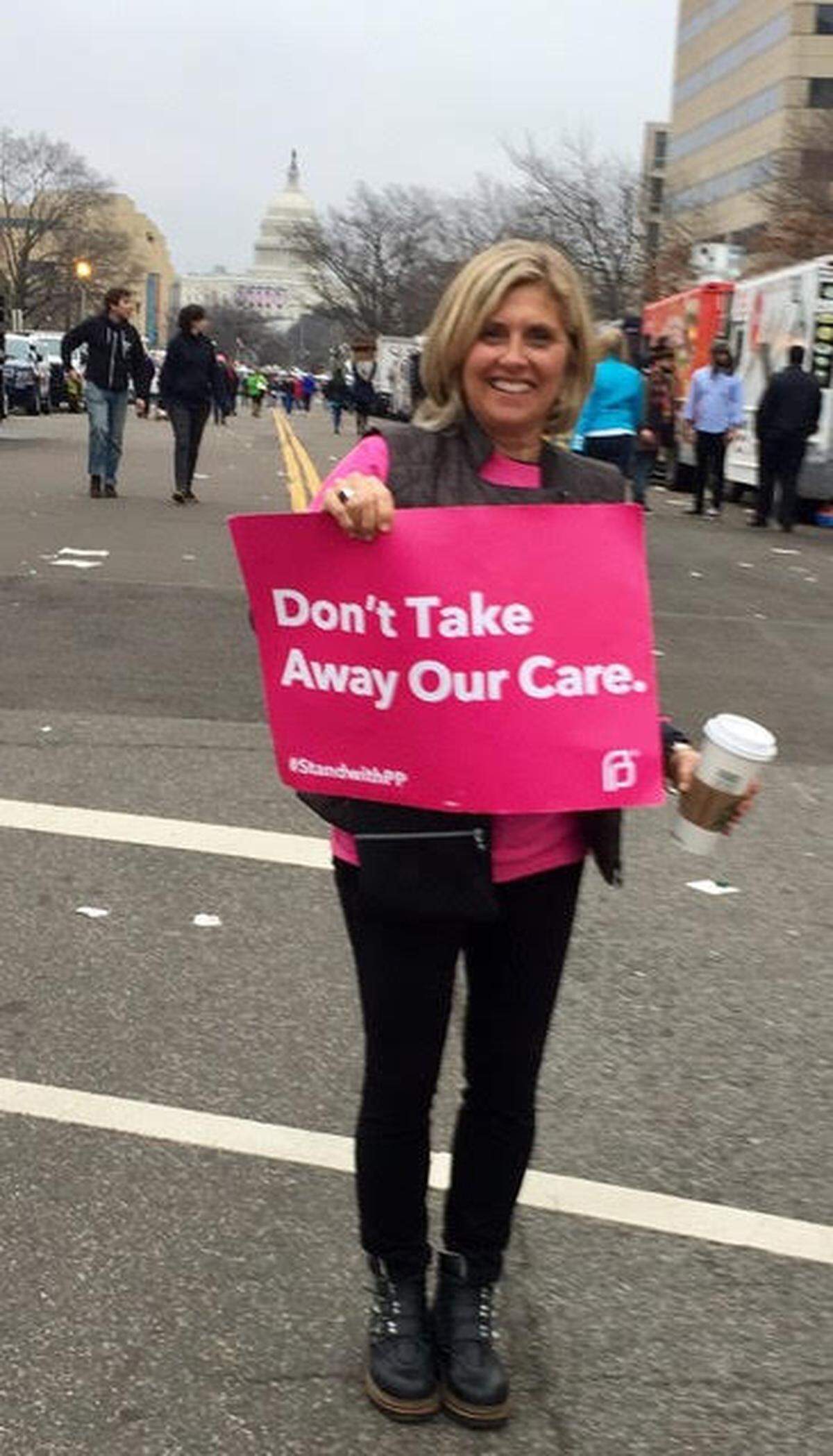 Marcie Shealy poses with a Planned Parenthood sign at a January 2018 protest in Washington, D.C.