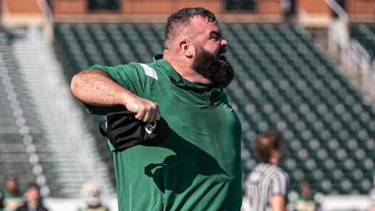 Charlotte football defensive coordinator Ryan Osborn gives direction to his players during a game last season.