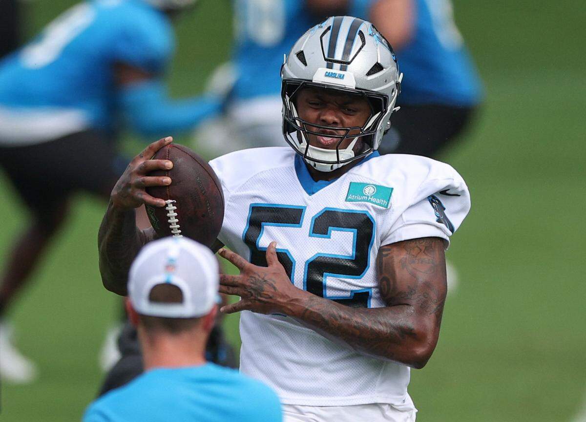 Panthers outside linebacker D.J. Johnson (52) catches a pass during training camp practice in Charlotte, NC on Monday, July 29, 2024.