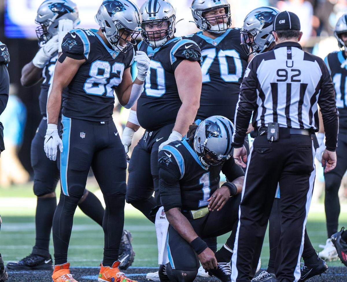 Carolina Panthers Cam Newton kneels after the Atlanta Falcons recovered his fumble Sunday. Newton had two turnovers in a 29-21 loss.