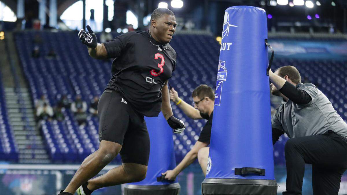 Auburn defensive lineman Derrick Brown runs a drill at the NFL football scouting combine in Indianapolis, Saturday, Feb. 29, 2020. (AP Photo/Michael Conroy)
