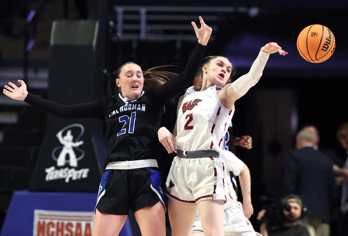 Lake Norman’s Alexis Shehan, left and Wakefield’s Lyla Bagwell, right, fight for control of a loose ball during the girls NCHSAA 4A State Championship game on Saturday, March 15, 2025 at Lawrence Joel Veterans Memorial Coliseum in Winston-Salem, NC. Lake Norman defeated Wakefield 43-41.