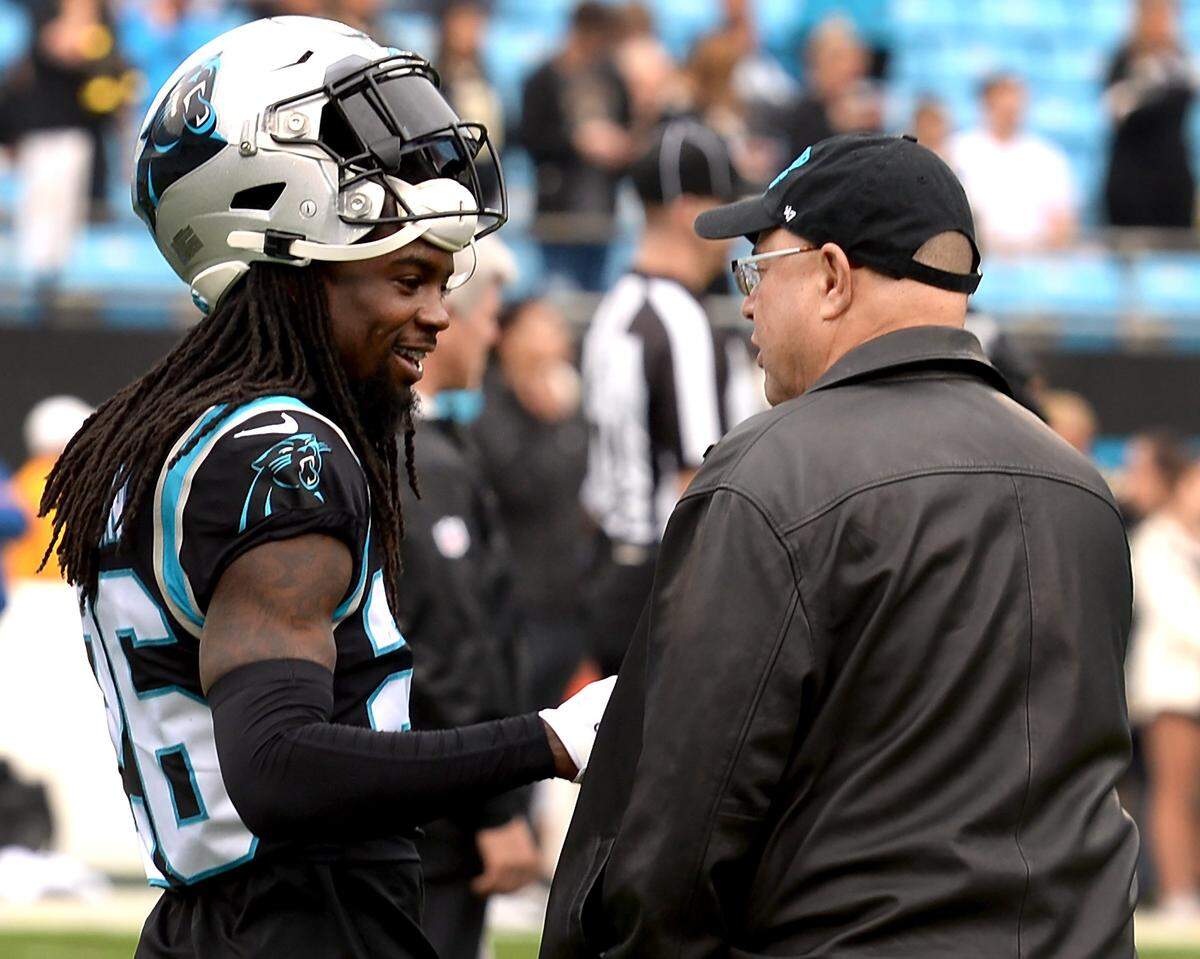Carolina Panthers cornerback Donte Jackson, left, jokes with team owner David Tepper prior to the team’s game against New Orleans Sunday. Tepper will soon hire a new coach for the Panthers, who lost their final eight games of 2019 to finish 5-11.