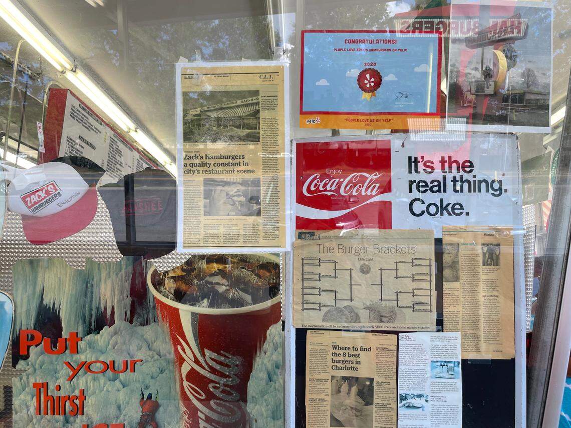 Reminders of years past adorn the wall at Zack’s Hamburgers.
