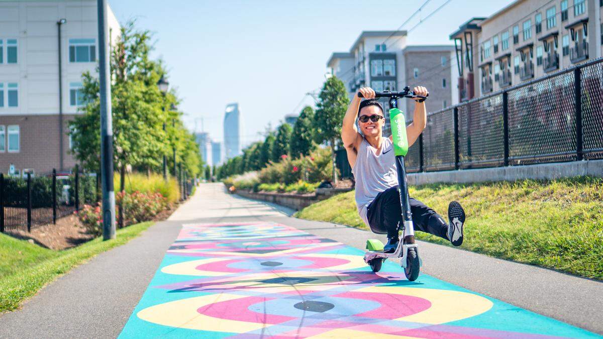 Photographer Kenty Chung has fun along the Rail Trail in Charlotte.