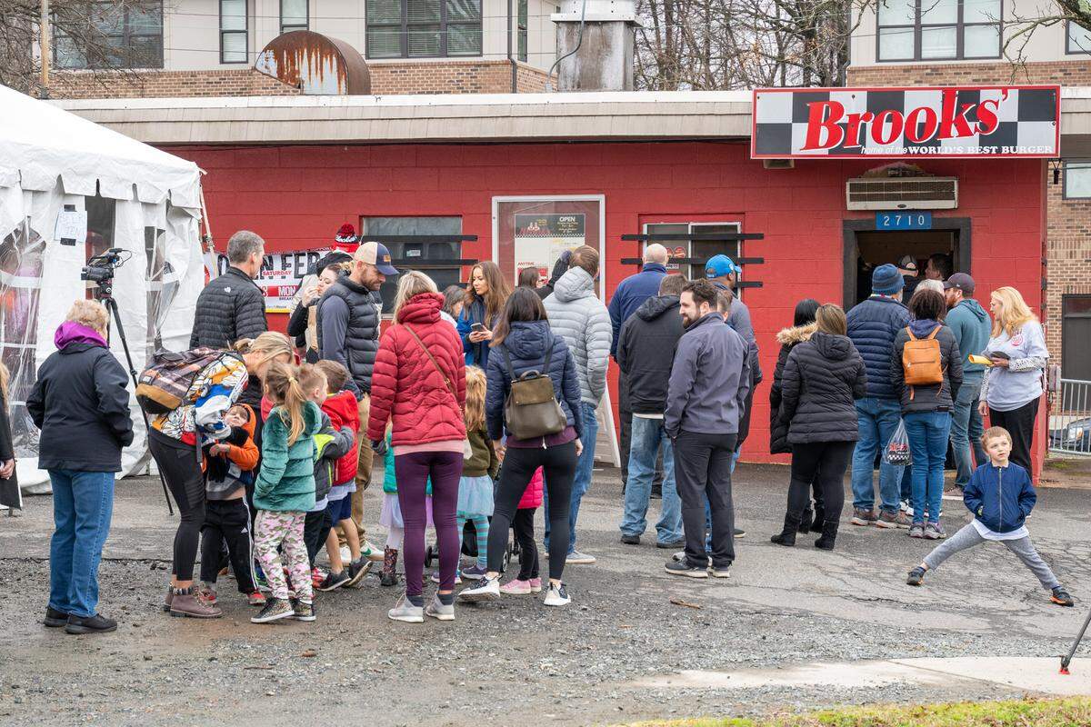 The line at Brooks’ Sandwich House extended around North Brevard Street on Saturday.