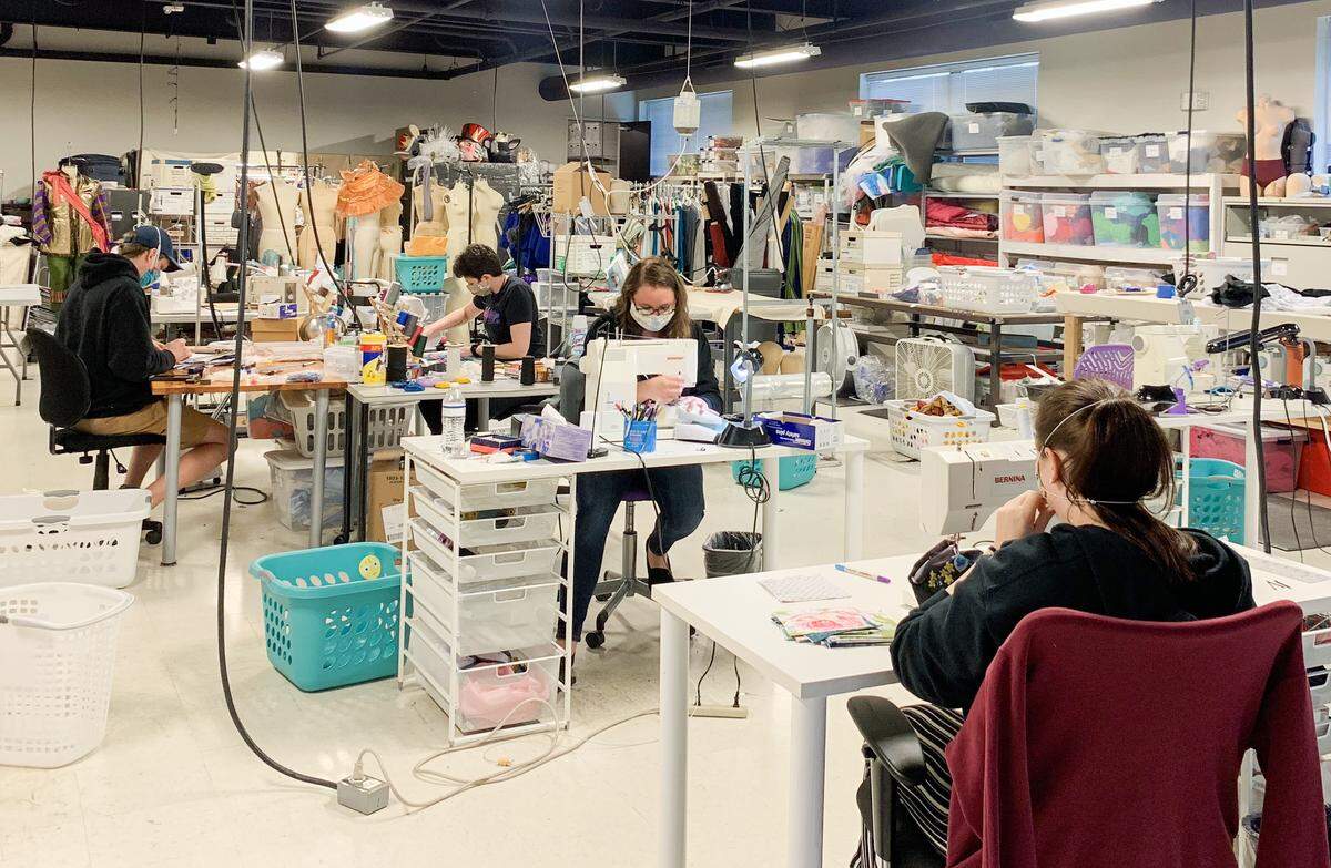 The costume shops at Charlotte Ballet and Children’s Theatre of Charlotte have been making and donating masks to local hospitals and others. Picture here are John Tringas, Liz Shinkle, Katherine Zywczyk, and Anna de la Cour of Charlotte Ballet sewing some of the more than 700 masks Charlotte Ballet donated to Atrium Health.