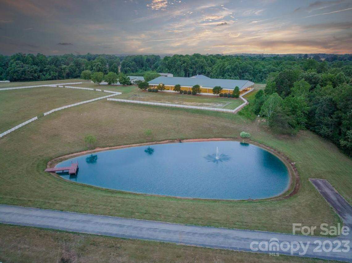 A pond on the property is pictured.