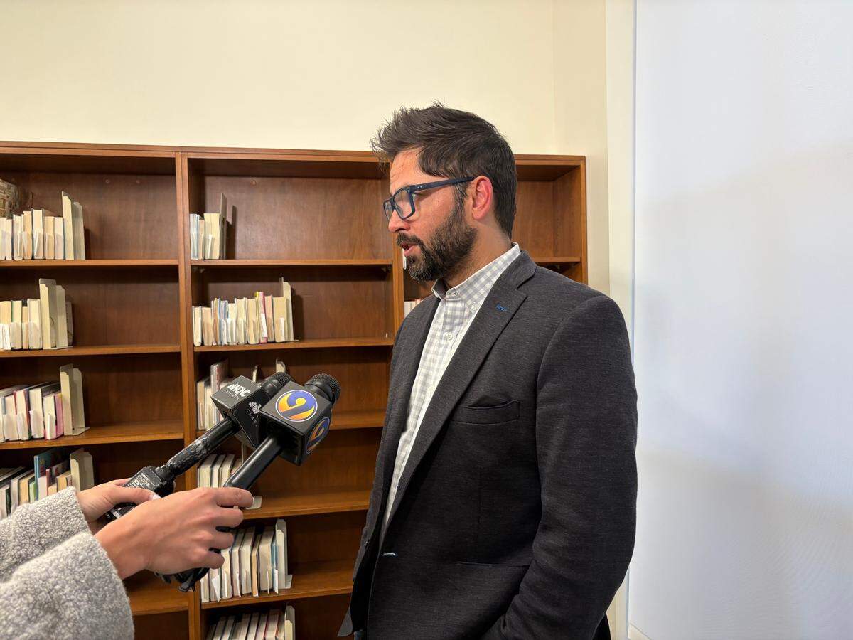Charlotte City Councilman Tariq Bokhari speaks to reporters at the SouthPark Regional Library on Monday after his final town hall meeting as District 6 representative.