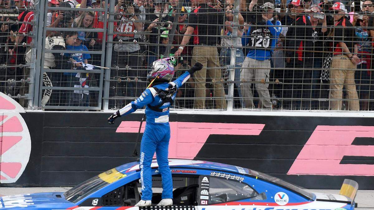 Kyle Larson (5) celebrates after winning a NASCAR Cup Series auto race at Texas Motor Speedway Sunday, Oct. 17, 2021, in Fort Worth, Texas. (AP Photo/Randy Holt)