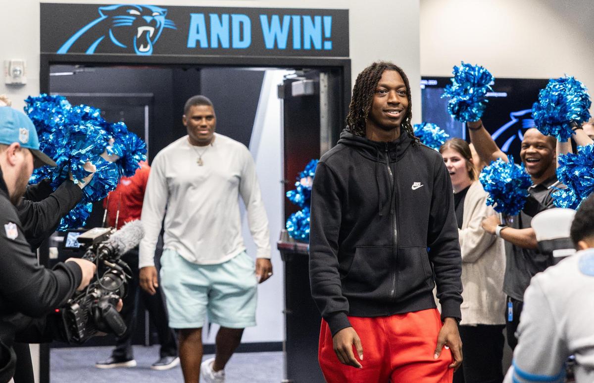 Carolina Panthers DL Derrick Brown surprises Monroe High football star Jordan Young with an invitation to Nike’s “The Next Ones” camp in the locker room at the Bank Of America Stadium in Charlotte, N.C., on Friday, January 26, 2024.