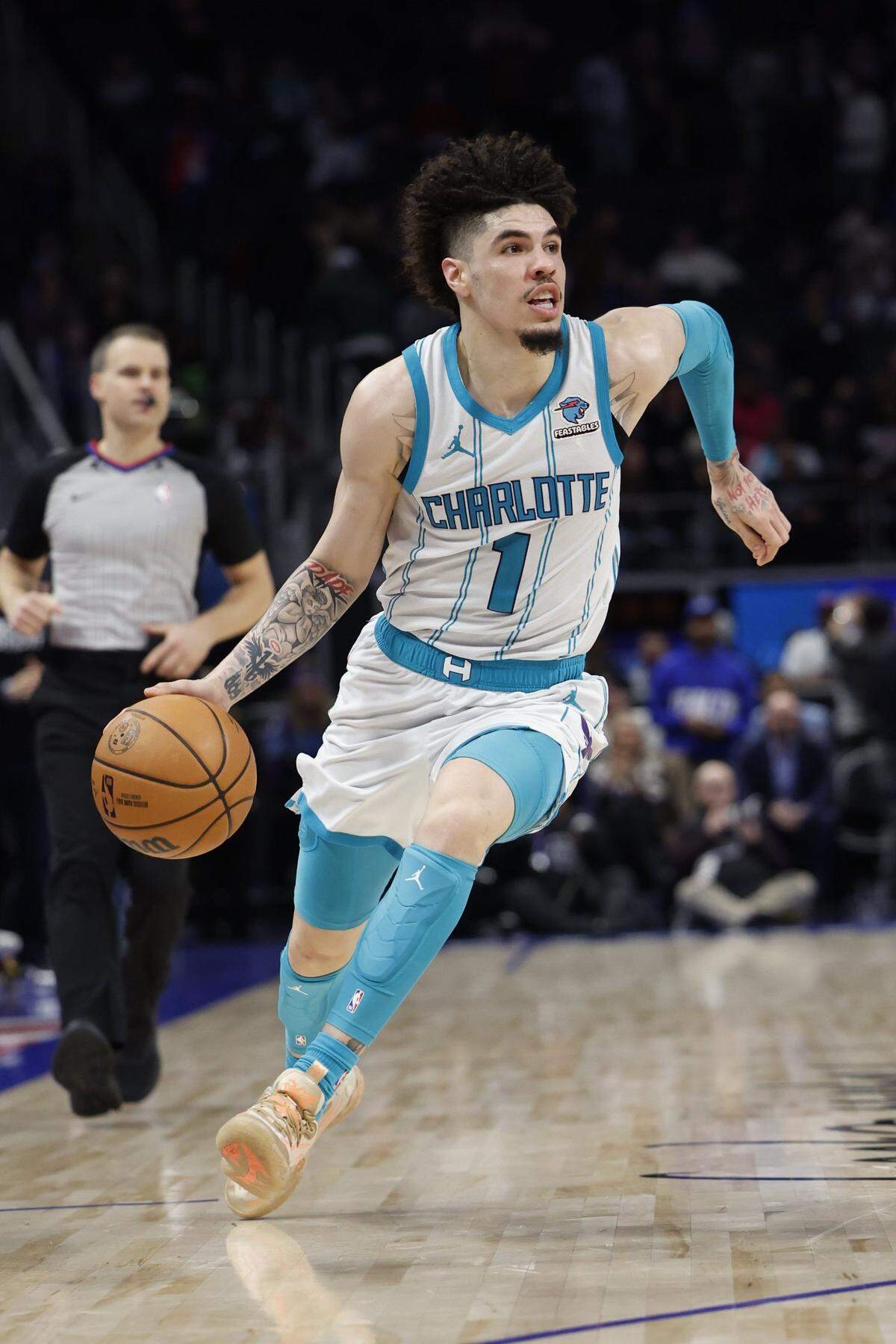 Charlotte Hornets guard LaMelo Ball (1) dribbles in the second half against the Detroit Piston at Little Caesars Arena.