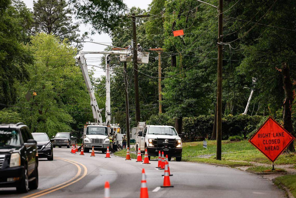 Workers tend to damages to power lines along South Chester Street caused by severe storms in Gastonia, N.C., on Thursday, May 9, 2024