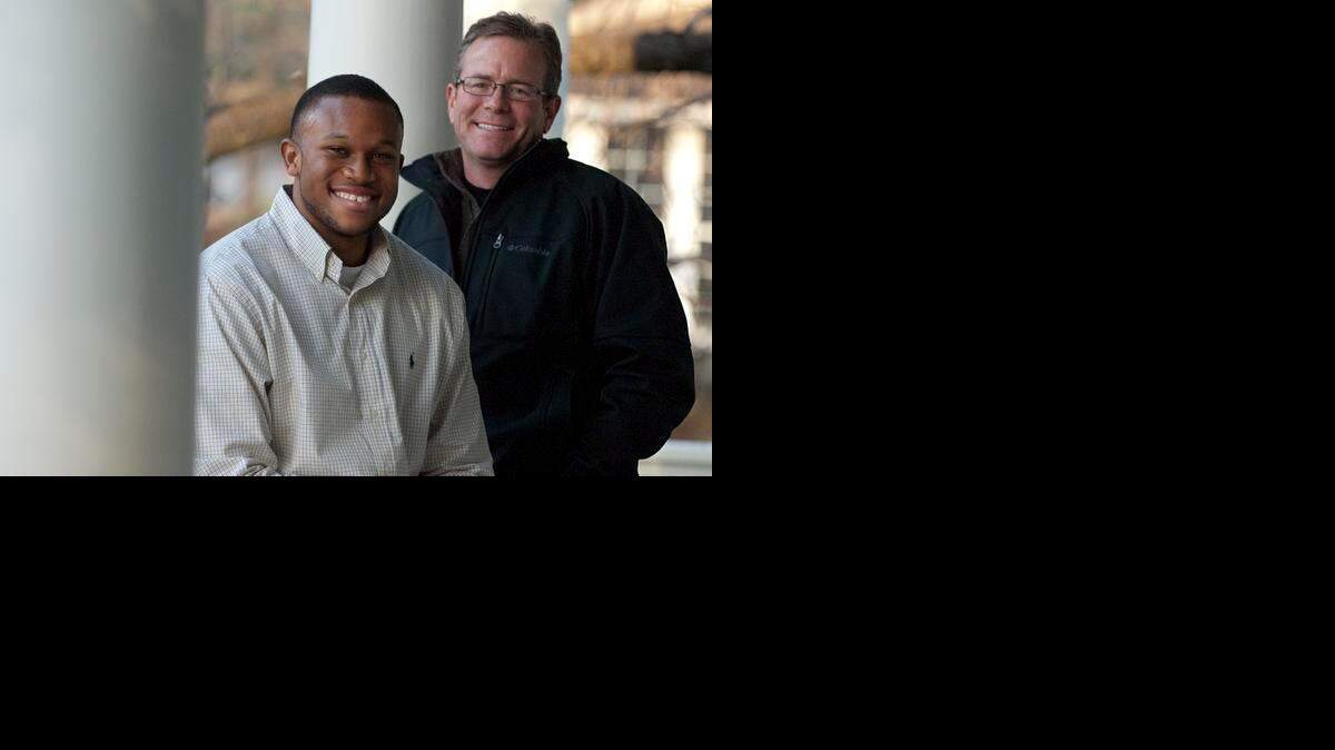 
Ike Anyachonkeya, left, and Steve Montgomery met when Ike was 7. JEFF WILLHELM - STAFF PHOTO
