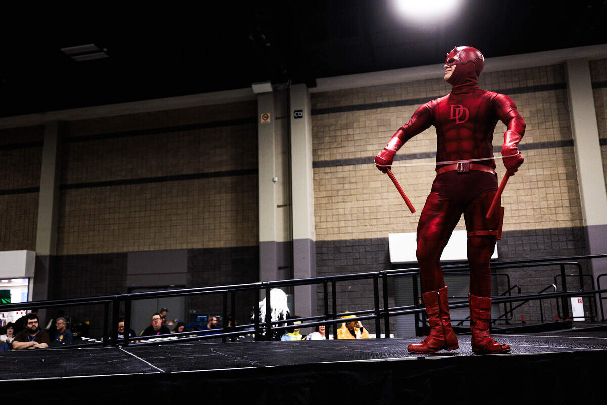 Fergus Mota, in Daredevil cosplay, adjusts his handmade “billy club” after the Heroes Convention cosplay contest on Friday, June 12, 2026 at the Charlotte Convention Center. Mota said he chooses to cosplay Daredevil because the character is a “good fictional display of the unbreakable human spirit.”