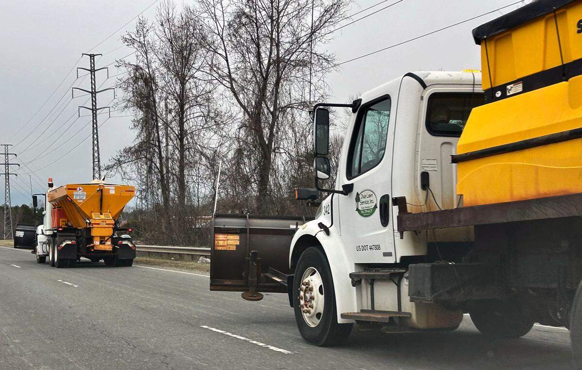 Snow plows ride along Highway NC 16 in preparation for snow that has been forecasted in the Charlotte area on Wednesday, February 19, 2025.