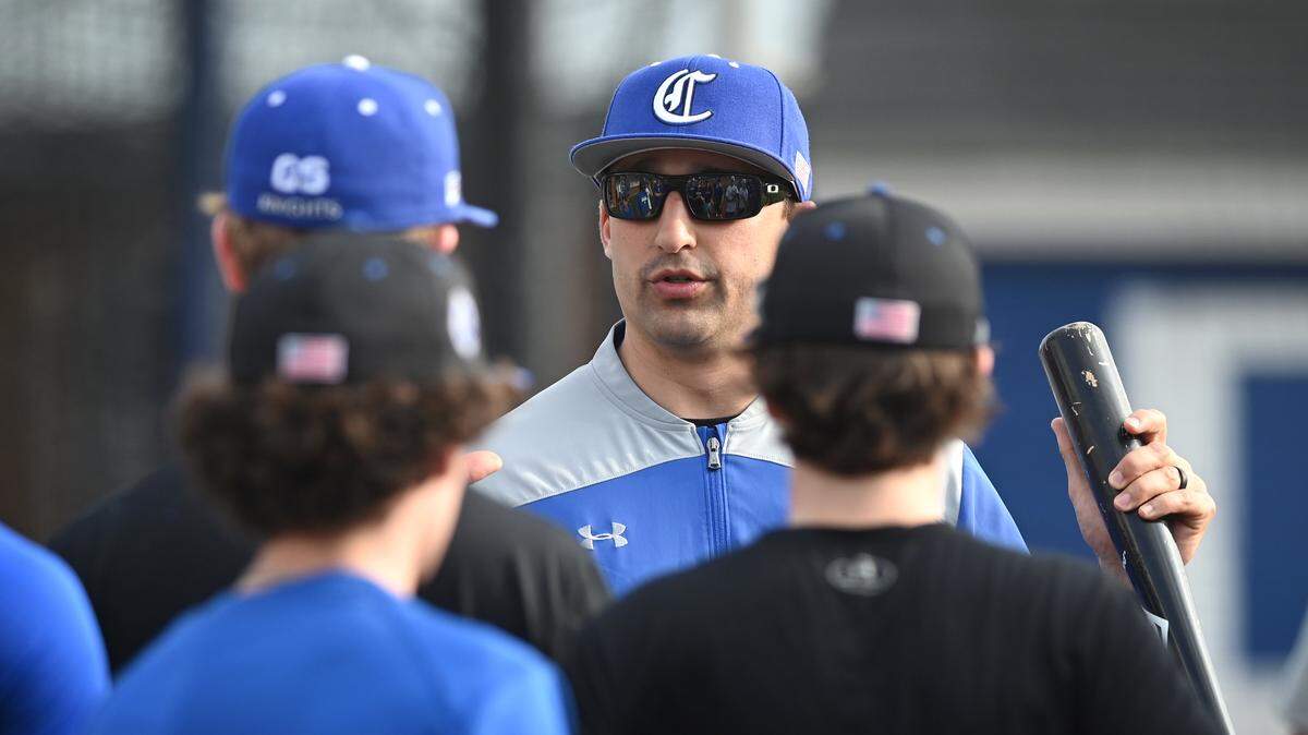 Charlotte Christian baseball coach Reid Fronk speaks to his players during practice on Thursday, February 23, 2023. Fronk leads a team that is favored to repeat as NCISAA state champions in 2023.