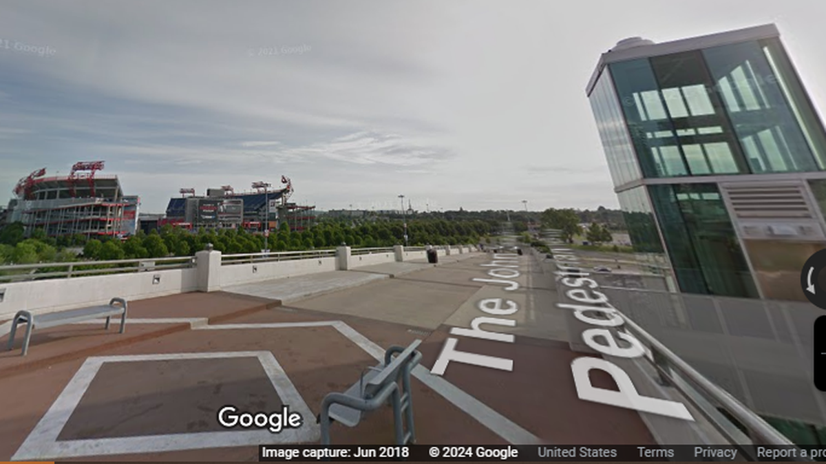 An armed 14-year-old boy is accused of throwing a scooter off a pedestrian bridge onto police vehicle parked outside Nissan Stadium, Tennessee officers say. 