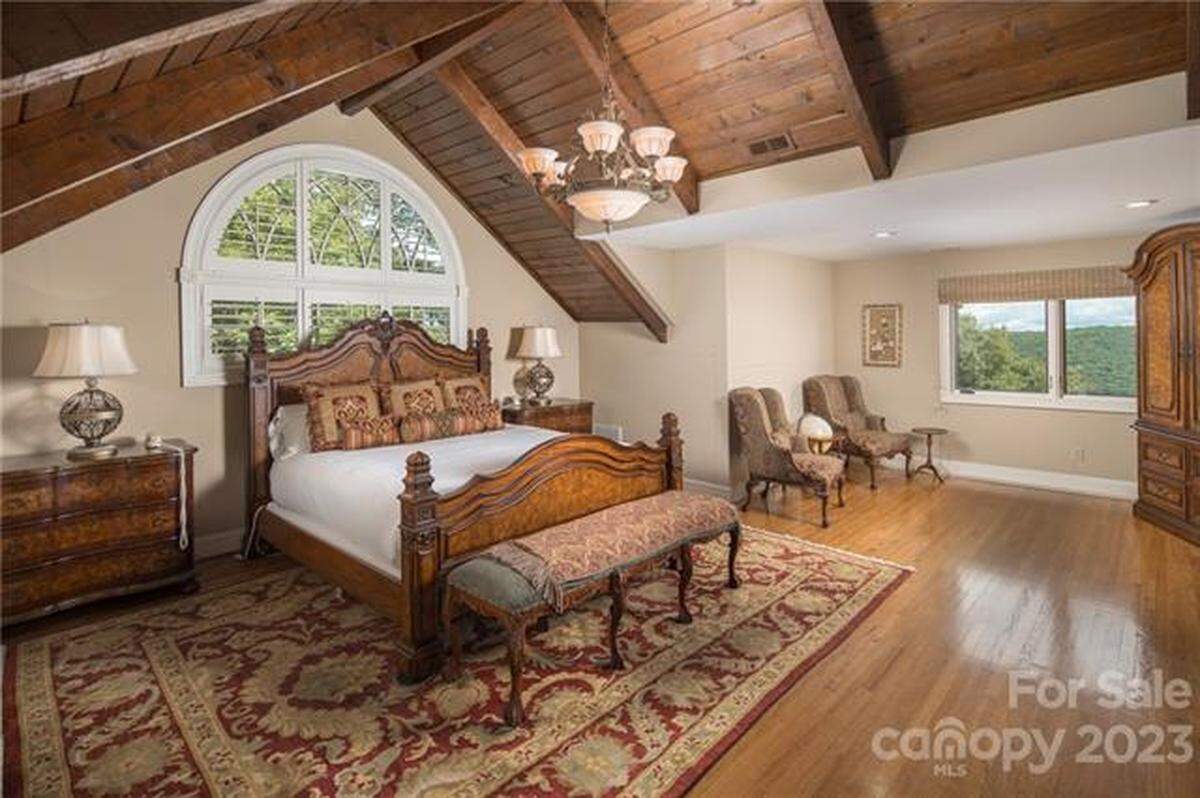 The property includes three primary residences with views of Johns River Gorge, stretching to the Charlotte skyline, and Grandfather Mountain.
