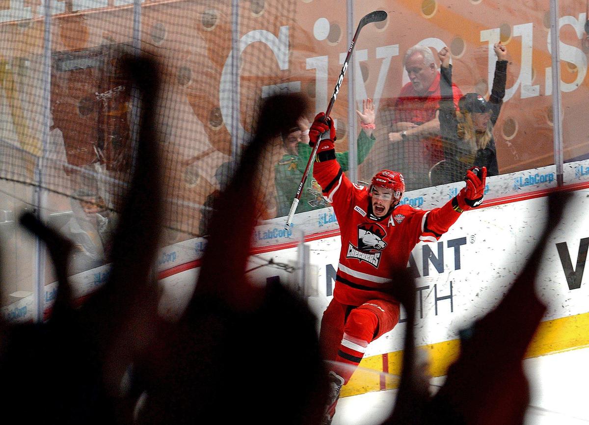Charlotte Checkers Andrew Poturalski celebrates a goal against the Chicago Wolves during first period action on Saturday, June 1, 2019 at Bojangles’ Coliseum in Charlotte, NC. At the end of first period action, the Checkers led the Wolves 3-1.