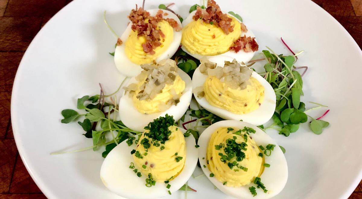 The deviled egg small plate at New South Kitchen features two of each kind: traditional, bacon and with pickles ($6.50).
