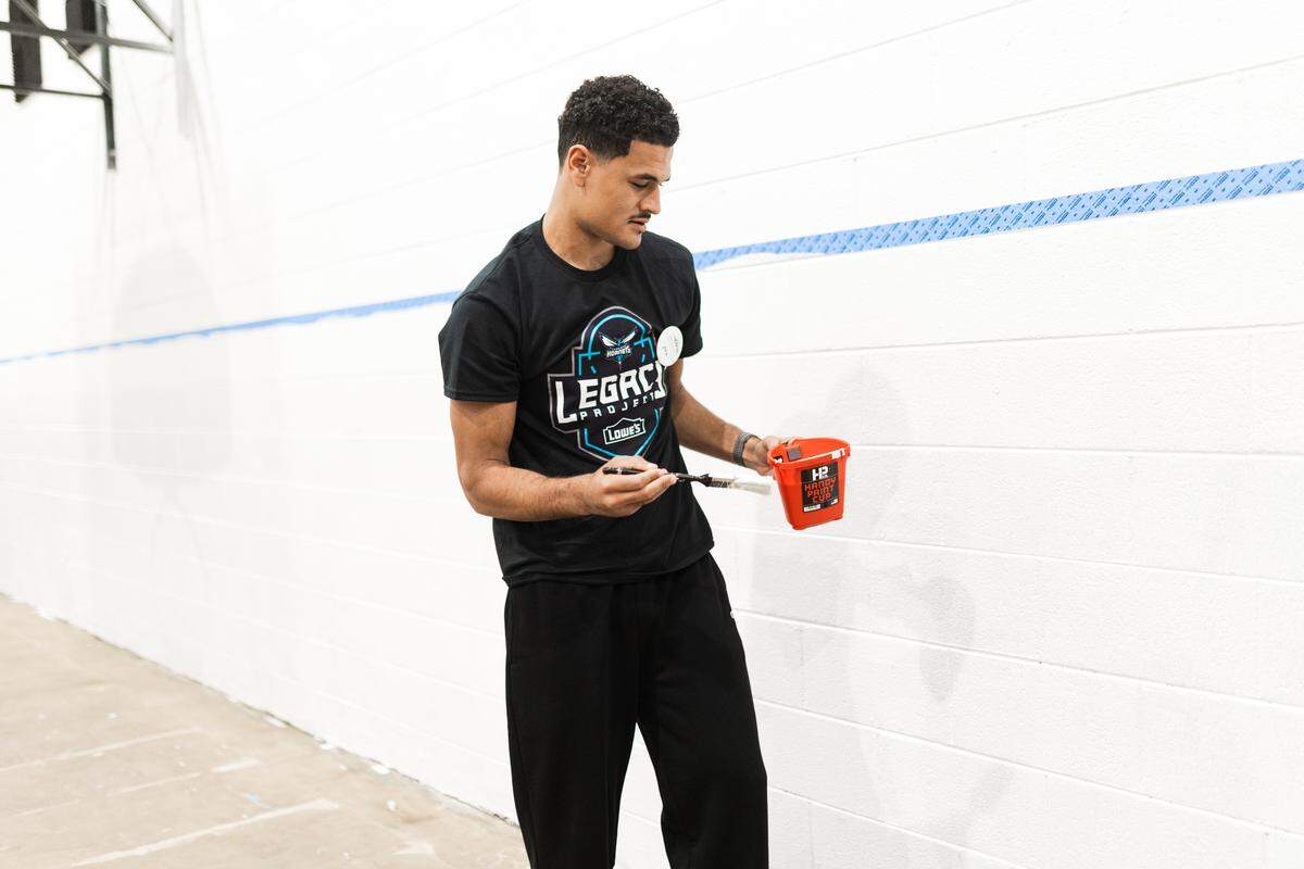 Josh Green of the Charlotte Hornets helps out at the Riverview Community Center in Creston, N.C.