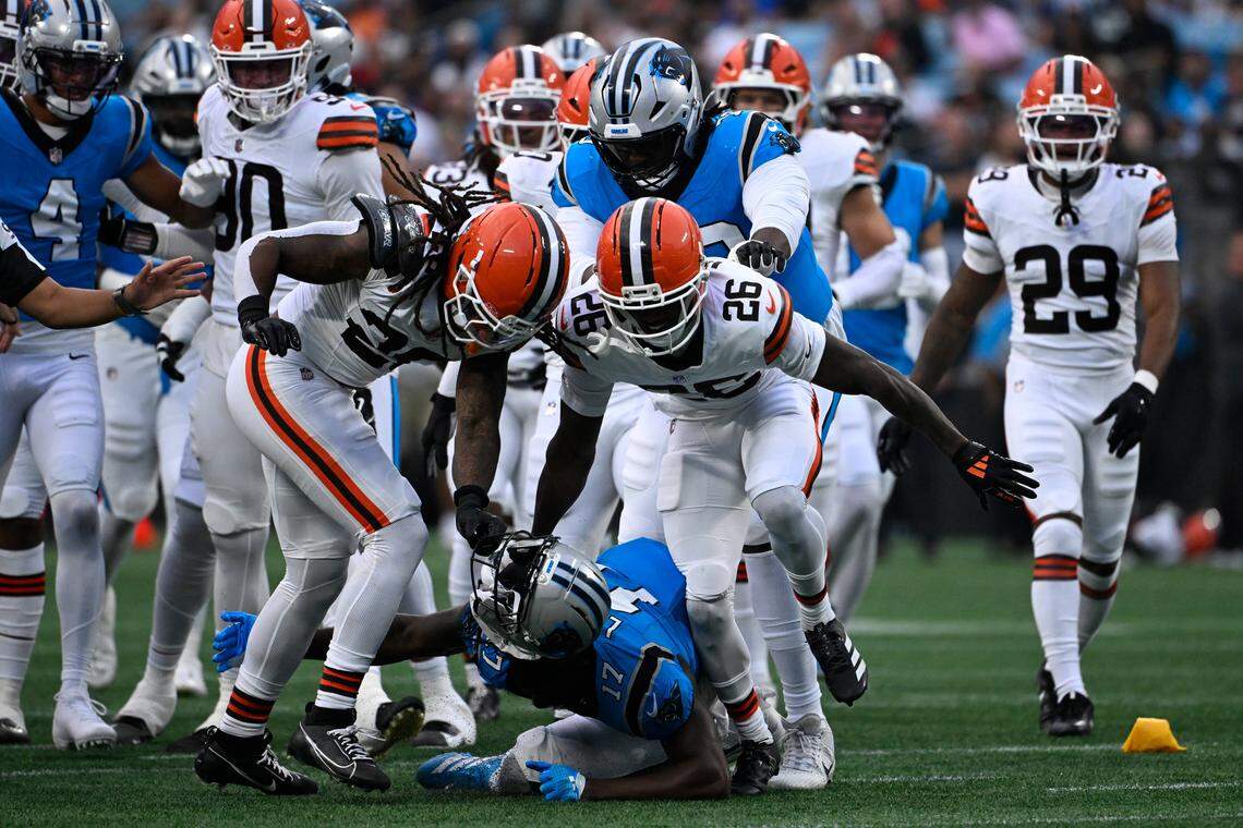 Cleveland Browns safety Rayshawn Jenkins (28) rips off Carolina Panthers wide receiver Xavier Legette (17) helmet in Friday’s first quarter at Bank of America Stadium. Both players were ejected on the play.