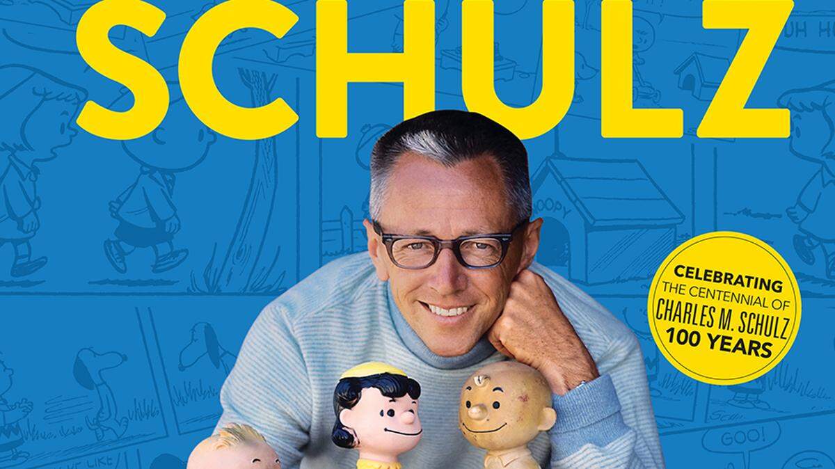 This is a photo of Charles M. Schulz on the cover of “Charles M. Schulz: The Art and Life of the Peanuts Creator in 100 Objects,” a book that explores the man behind Charlie Brown, Snoopy, Linus, and the rest of the Peanuts Gang.