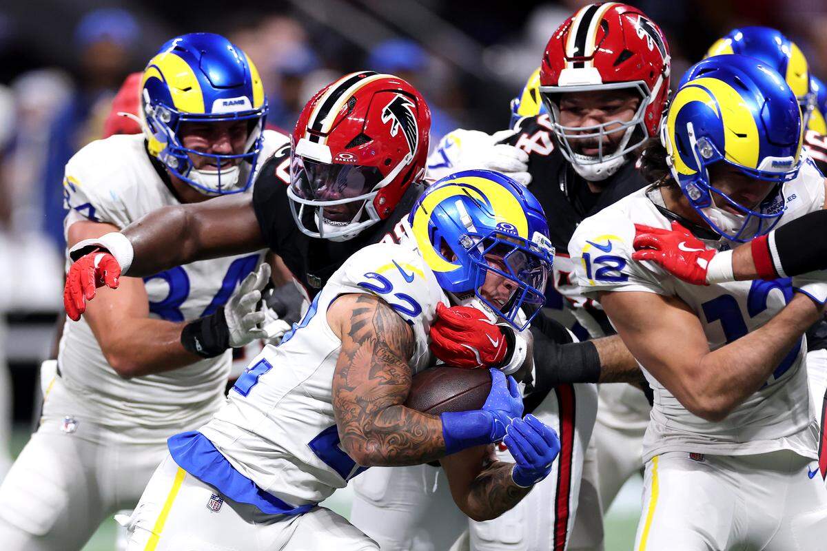 Los Angeles Rams running back Blake Corum is tackled by Atlanta Falcons defensive lineman Ruke Orhorhoro during the first quarter at Mercedes-Benz Stadium on Dec. 29, 2025, in Atlanta.
